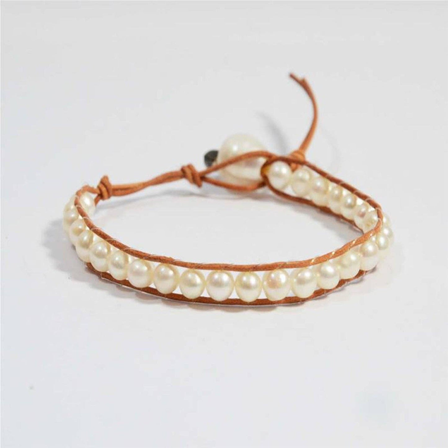 Delicate pearl and leather knotted bracelet with pearl clasp