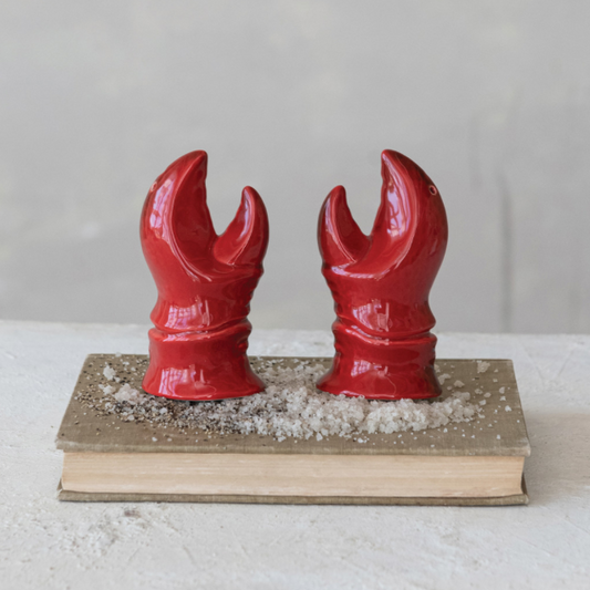 Stoneware lobster claw S&P shakers.