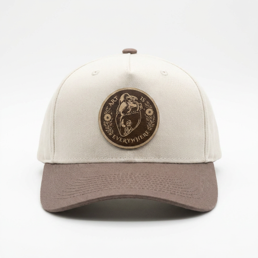 Art Is Everywhere Signature Snapback Hat by lovisART — cream crown with brown brim and original leather patch design